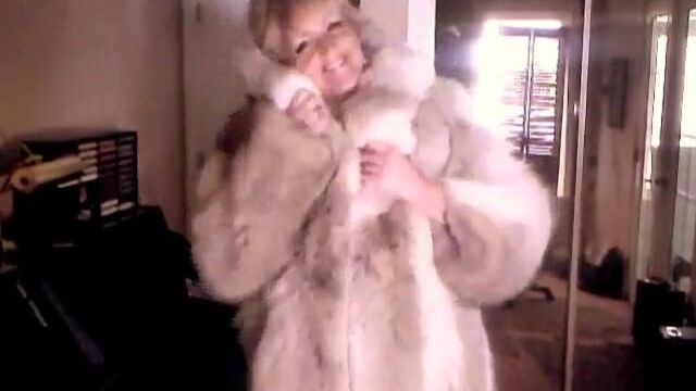 Sexy Woman showing off her Wolf Fur Coat II