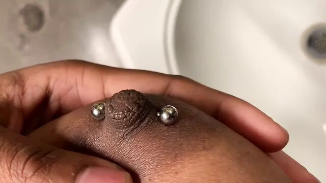 Black busty Youtuber gets nipples pierced